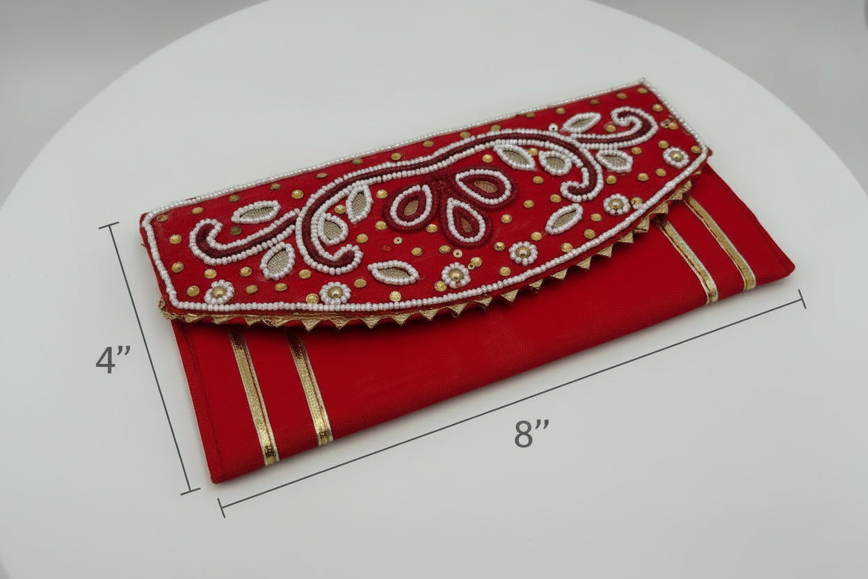 Red clutch bag with white embroidery on a white background