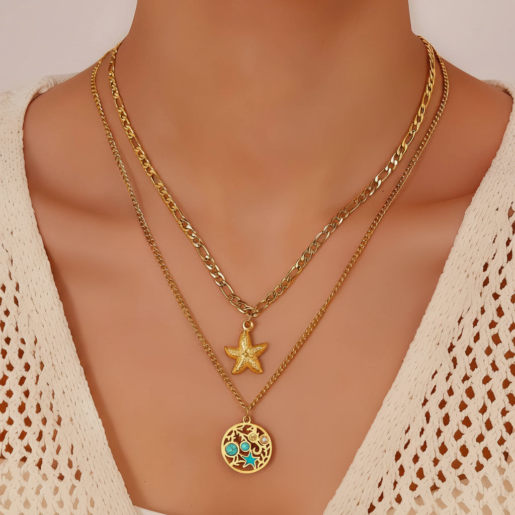 Gold necklaces with star and circular pendant on a mannequin