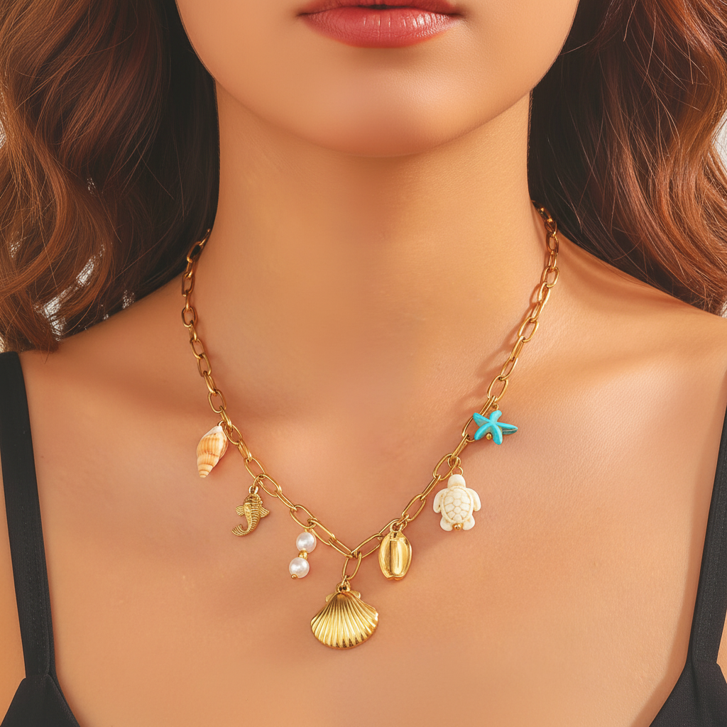water proof Gold necklace with various charms worn by a model