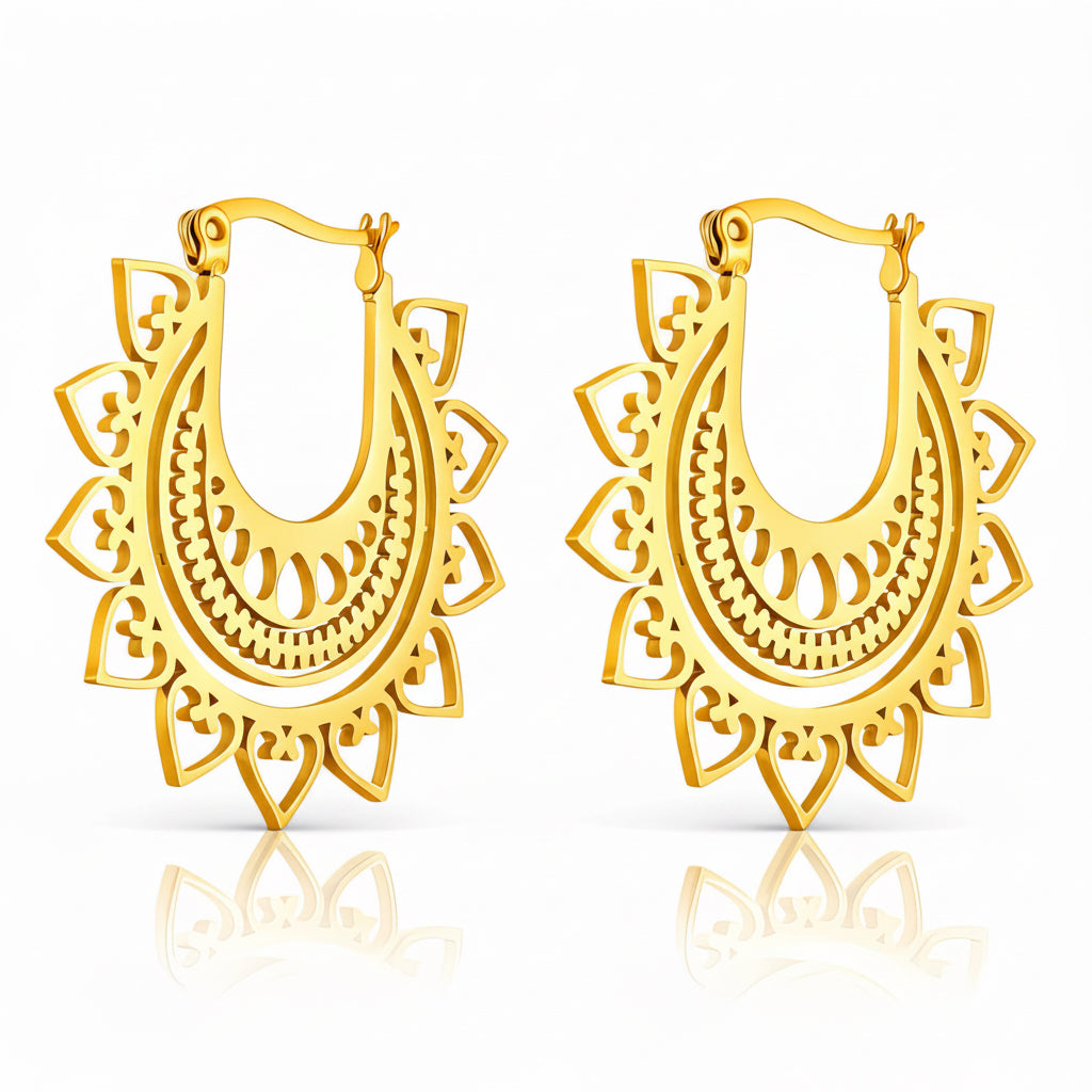 Pair of gold hoop earrings with intricate designs on a white background