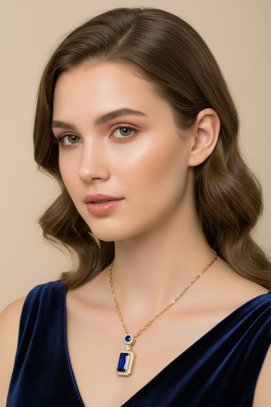 Woman wearing a gold necklace with a blue pendant against a beige background
