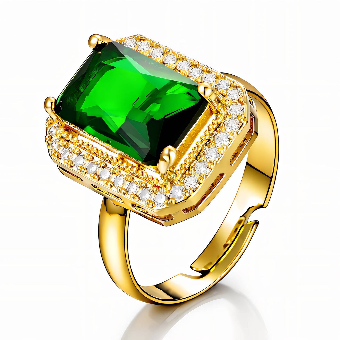 Gold ring with a green gemstone and diamond accents on a white background