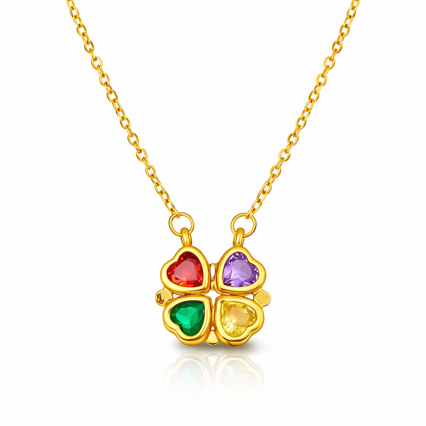 Gold necklace with a four-leaf clover heart shape pendant featuring colorful gemstones on a white background
