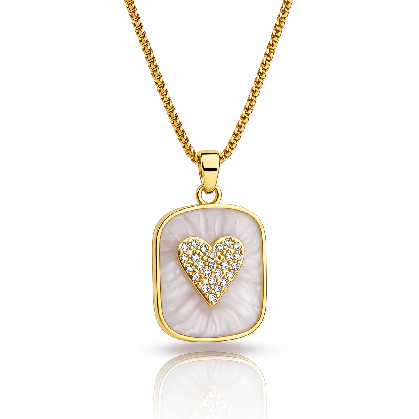 Gold necklace with a heart-shaped pendant on a white background