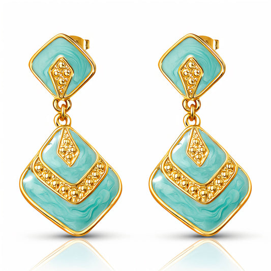 Turquoise gold plated earrings on a white background