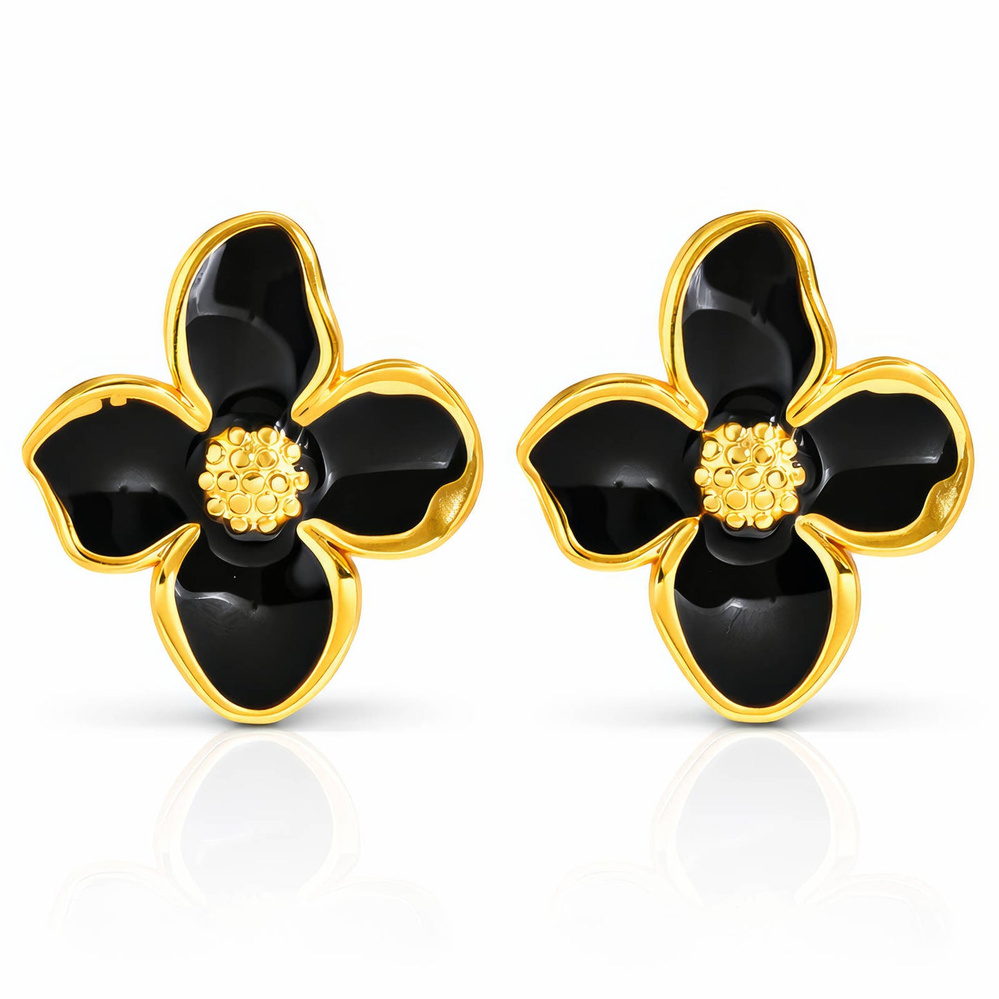 Black flower-shaped earrings with gold accents on a white background