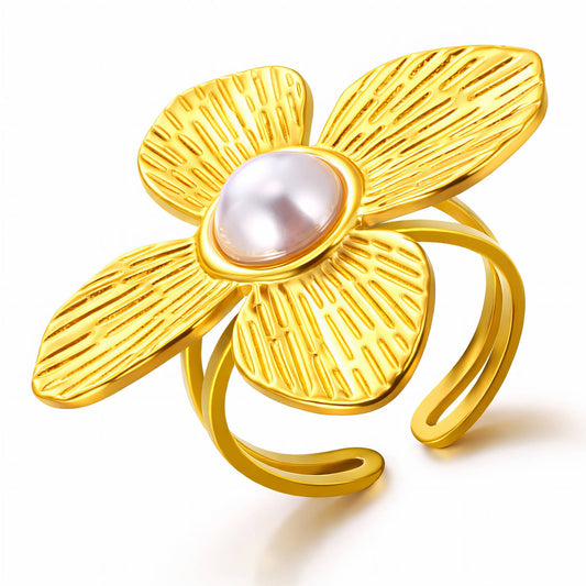 Gold flower-shaped ring with a pearl center on a white background