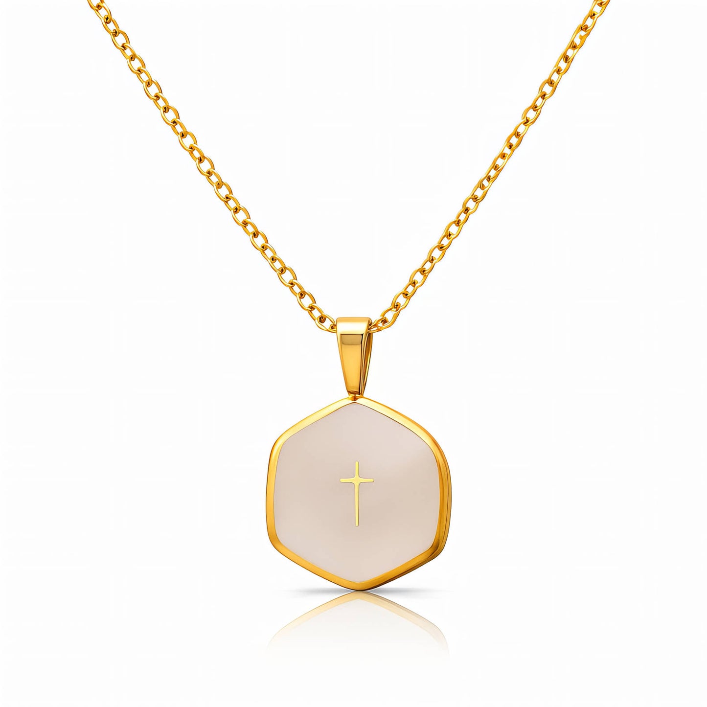 Gold necklace with a hexagonal pendant featuring a cross on a white background