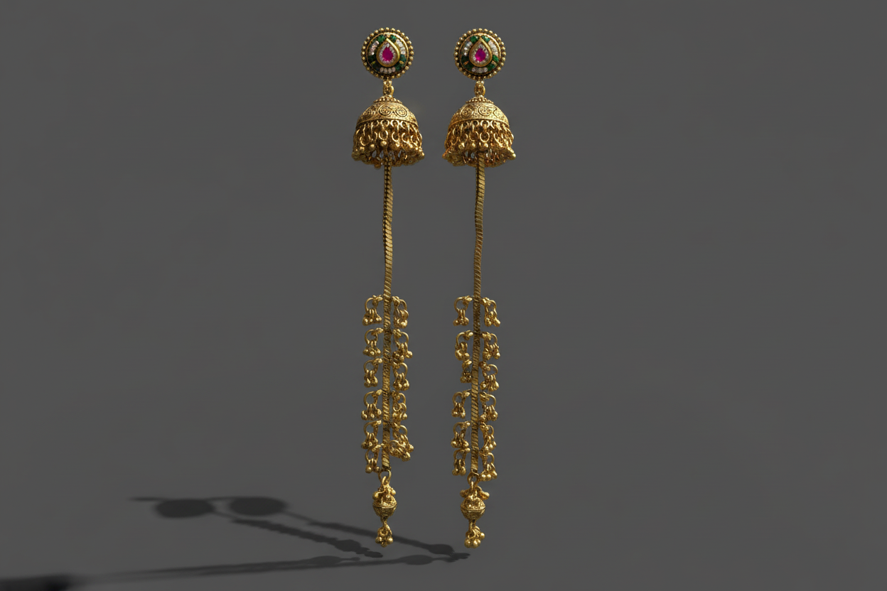 Gold earrings with intricate designs on a dark background