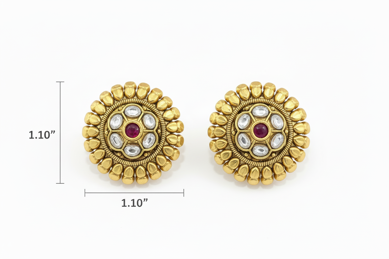 Pair of gold earrings with gemstones on a white background