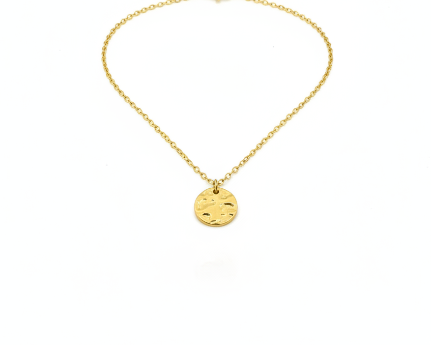 Gold necklace with a round pendant on a white background