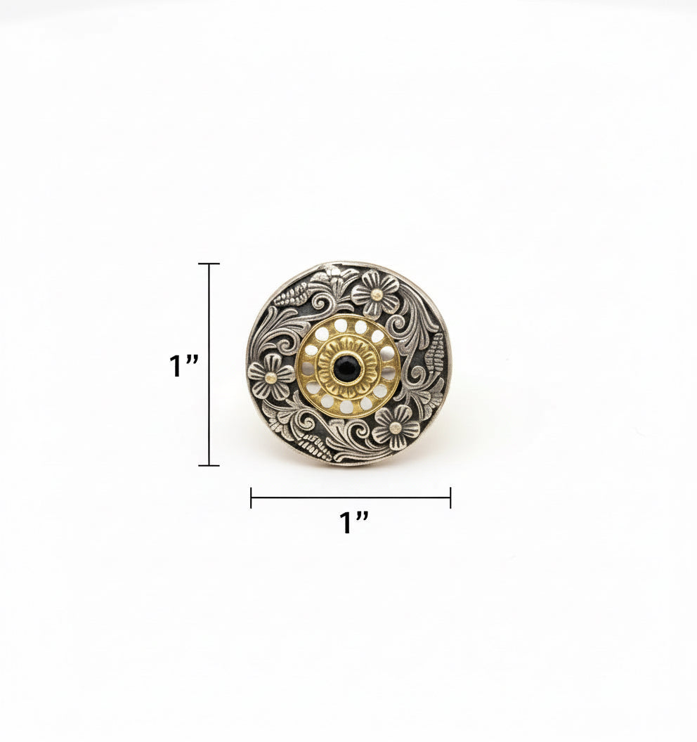Decorative button with intricate design on a white background