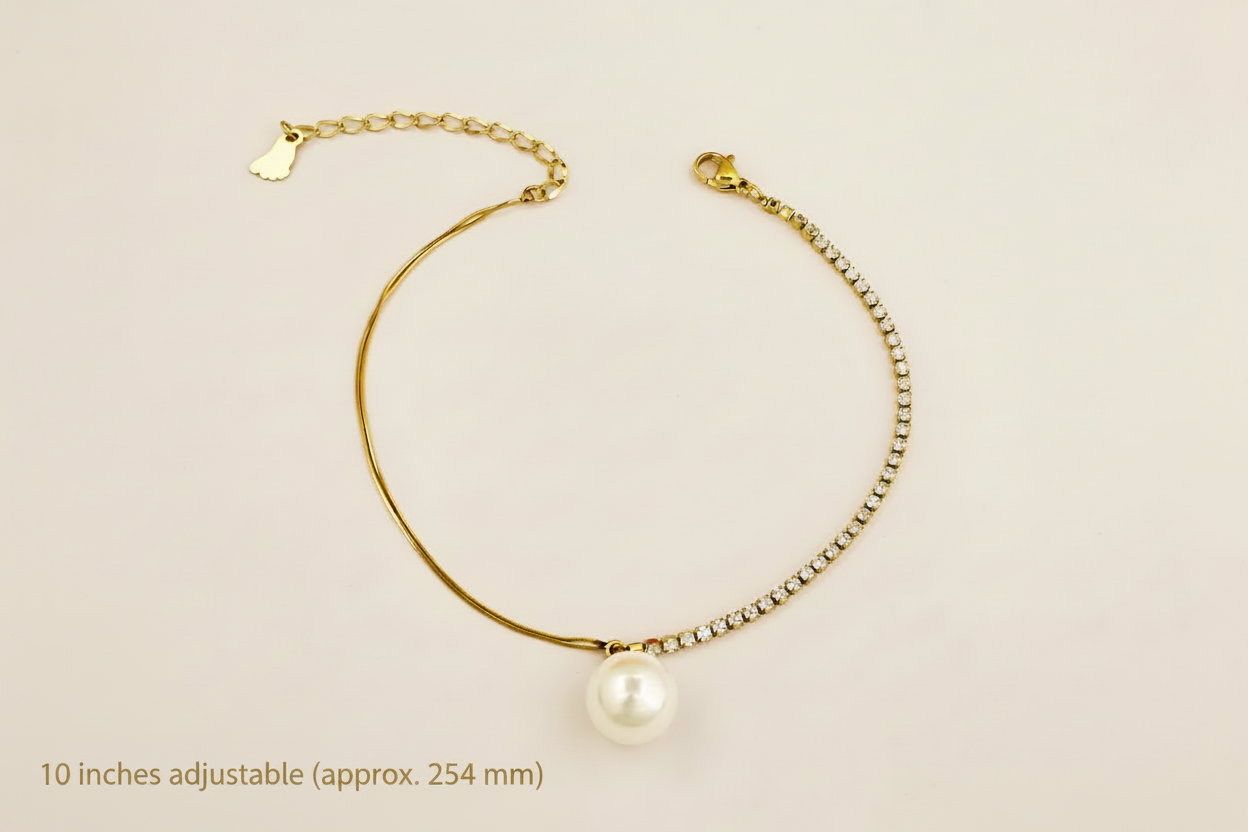 Gold anklet with a pearl on a beige background