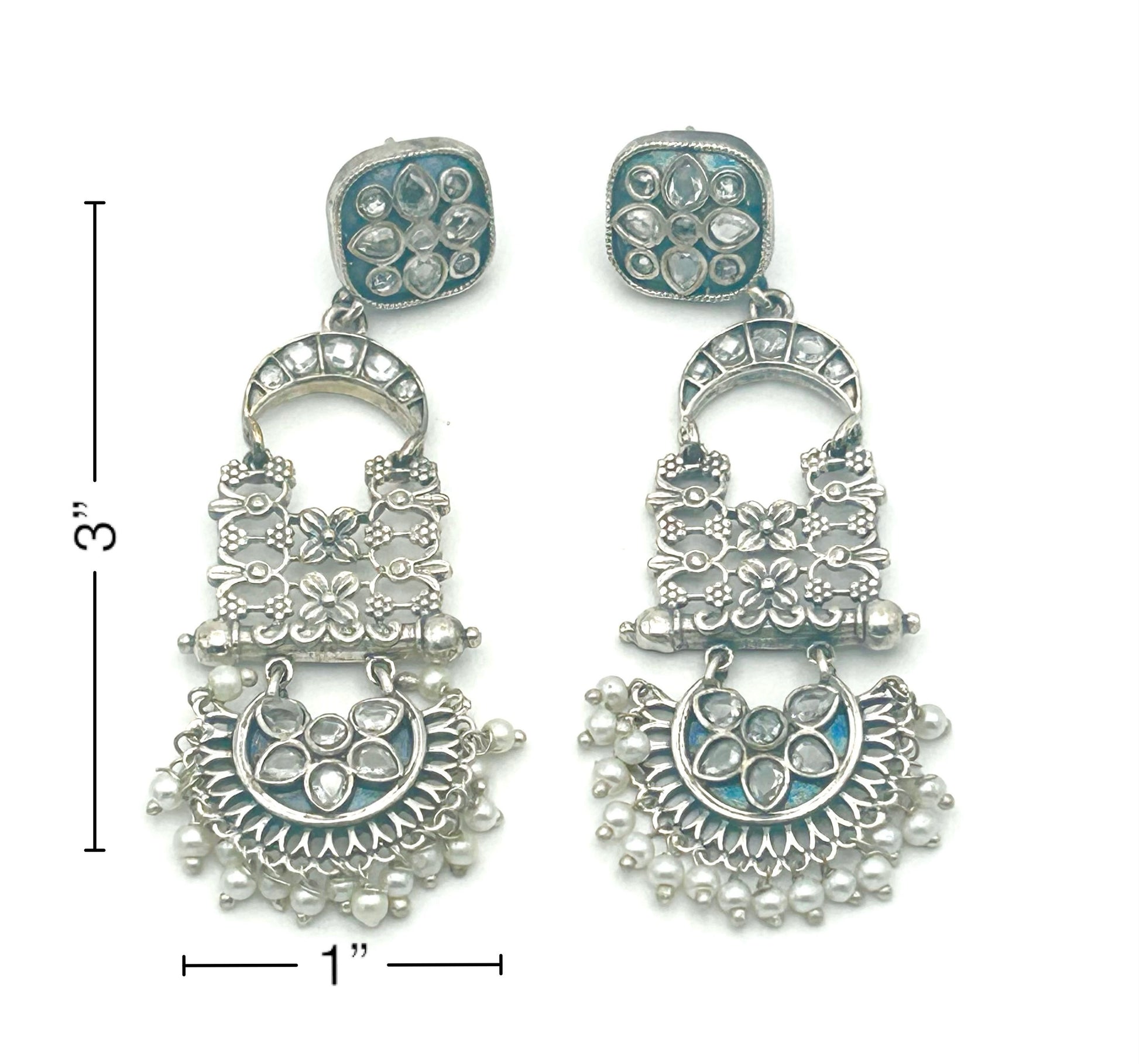 Pair of silver earrings with intricate designs and pearl-like beads, shown with measurements on a white background.
