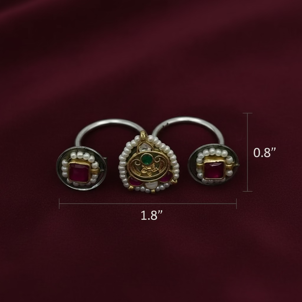 Pair of earrings with gemstones and pearls on a light gray background