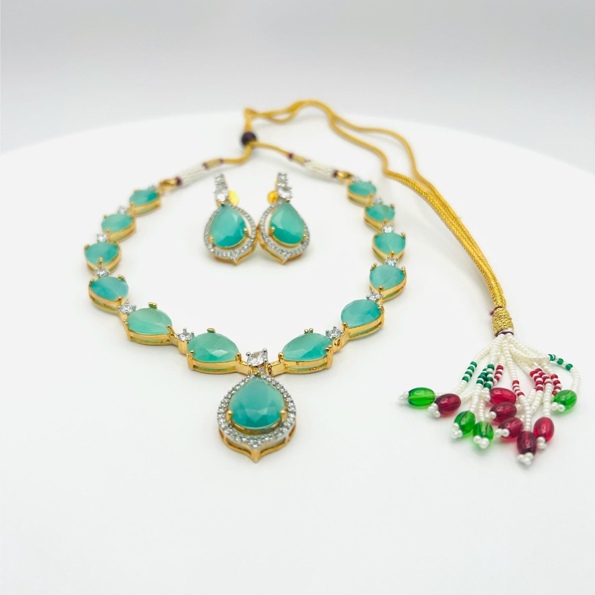 Jewelry set with turquoise stones on a white background